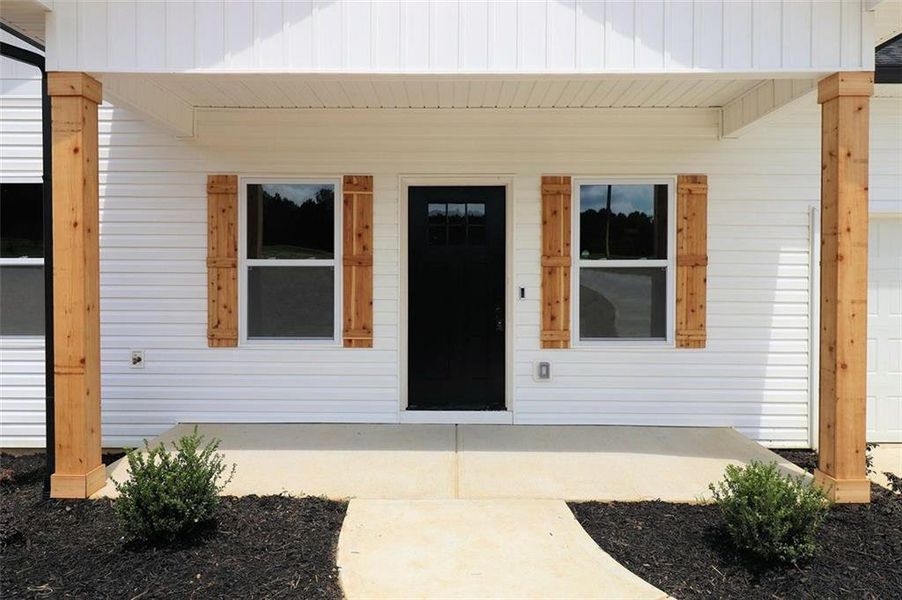 Front exterior of a new home in , Carrollton, GA, highlighting curb appeal (Image 18).