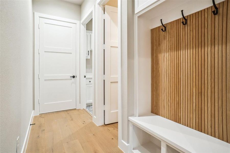 Rear family entry from garage offers access to laundry room, powder bath and mud bench with great storage! Rear family entry from garage offers access to laundry room, powder bath and mud bench with great storage!