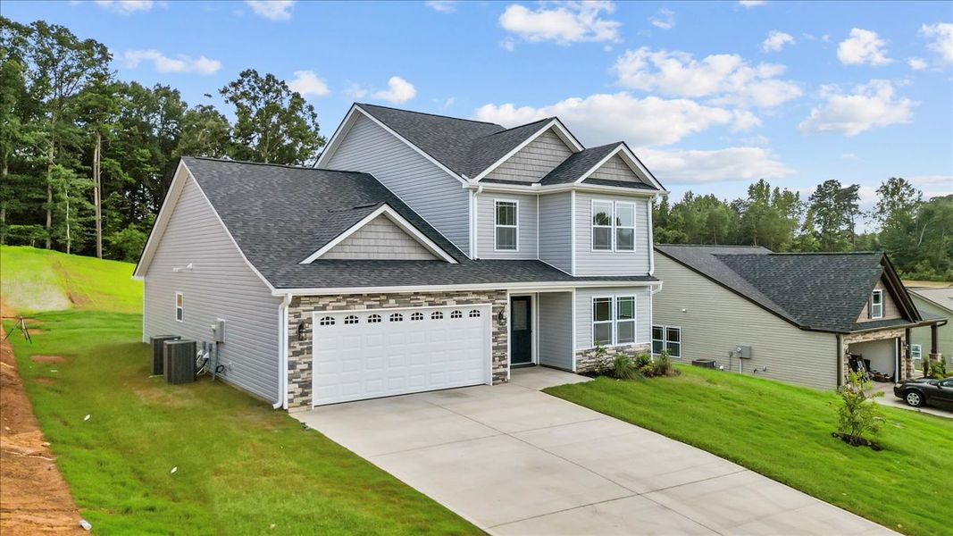 Representative exterior photo of a completed home built from the Ridge by Enchanted Homes in Lonesome Dove, San Antonio, TX (Image 18).