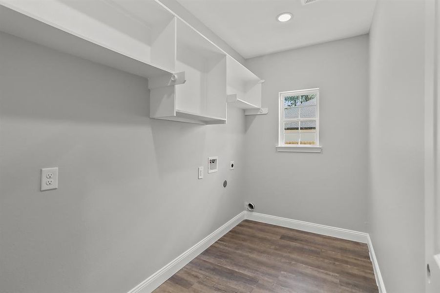 This spacious laundry room is designed to make household chores a breeze, combining practicality with modern design.