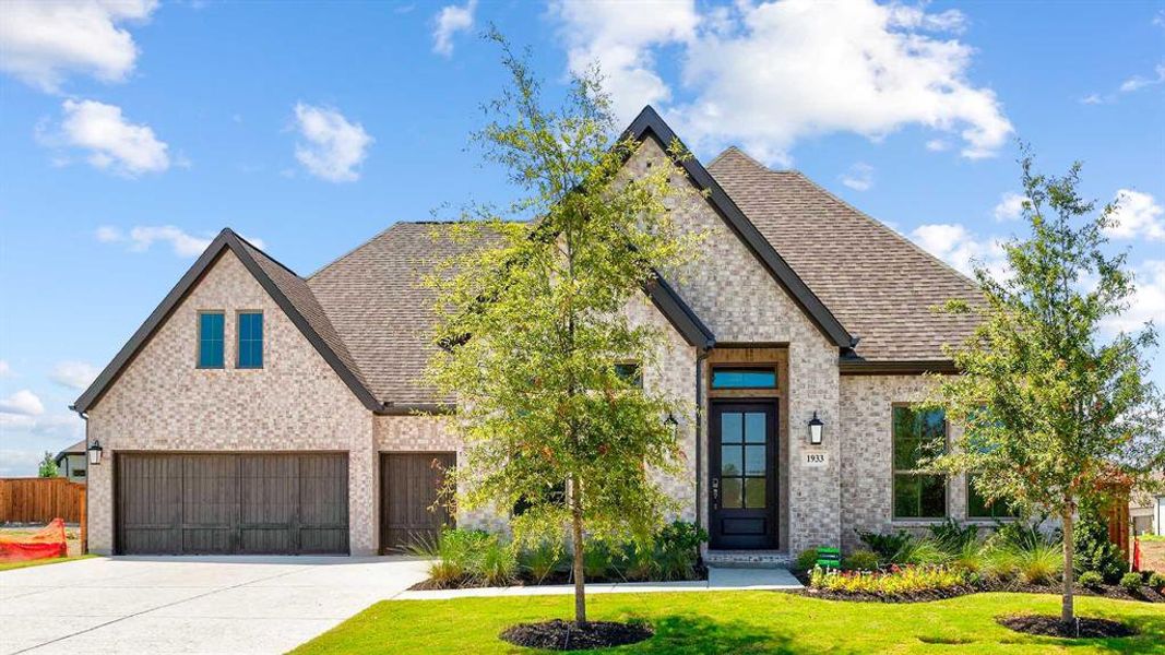 Front exterior of a new home in Terraces 72', Rockwall, TX, highlighting curb appeal (Image 2). Front exterior of a new home in Terraces 72', Rockwall, TX, highlighting curb appeal (Image 2).