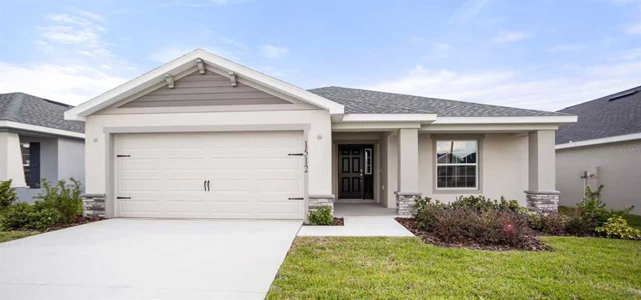 Front exterior of a new home in Geneva Landings, Davenport, FL, highlighting curb appeal (Image 1). Front exterior of a new home in Geneva Landings, Davenport, FL, highlighting curb appeal (Image 1).