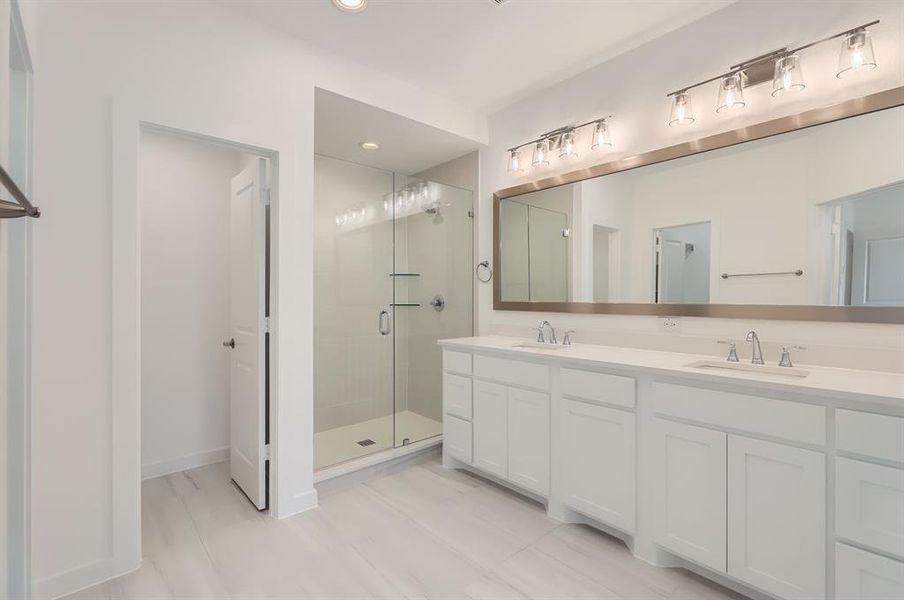 Bathroom with vanity and an enclosed shower