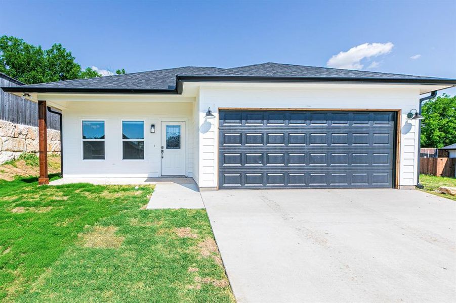 Front exterior of a new home in , West, TX, highlighting curb appeal (Image 1).