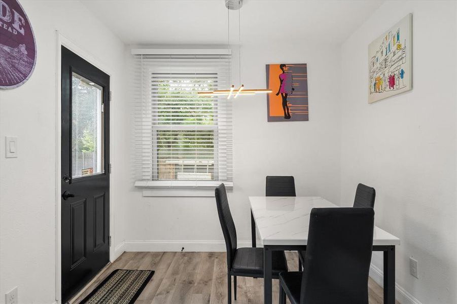 Dining space featuring wood finished floors and baseboards Dining space featuring wood finished floors and baseboards