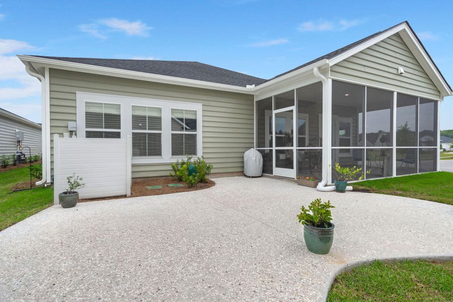 Front exterior of a new home in Horizons at Summers Corner | 55+: The Legends, Summerville, SC, highlighting curb appeal (Image 24).