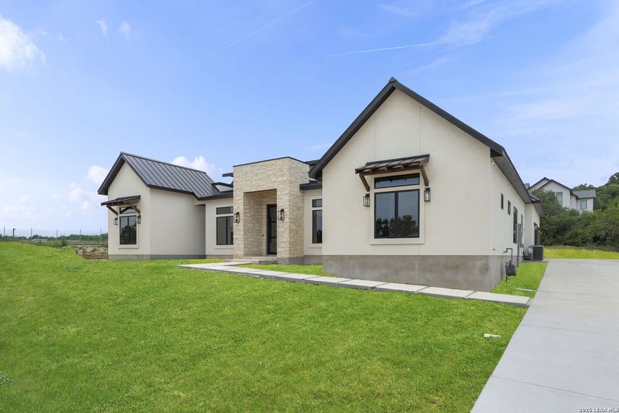 Front exterior of a new home in , San Antonio, TX, highlighting curb appeal (Image 30).