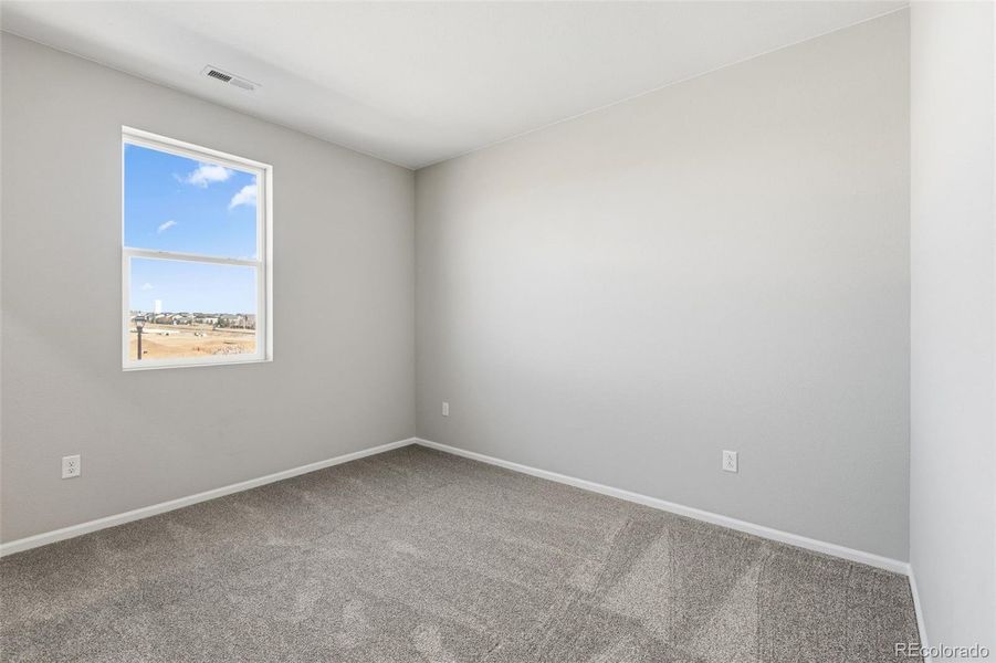 Spacious, unfurnished interior of a new home in The Estates Collection at Talon Pointe, Thornton (Image 28).