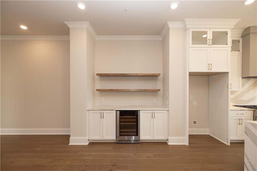 Indoor dry bar with recessed lighting, white cabinetry, open shelves, wine cooler, and dark wood finished floors