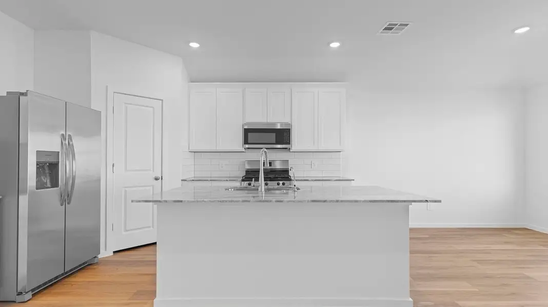 Furnished interior view inside a new home in Caldwell Crossing, Iowa Colony (Image 3).