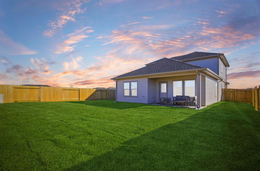 Exterior details and patio area of a home in Caldwell Crossing, Iowa Colony (Image 24).