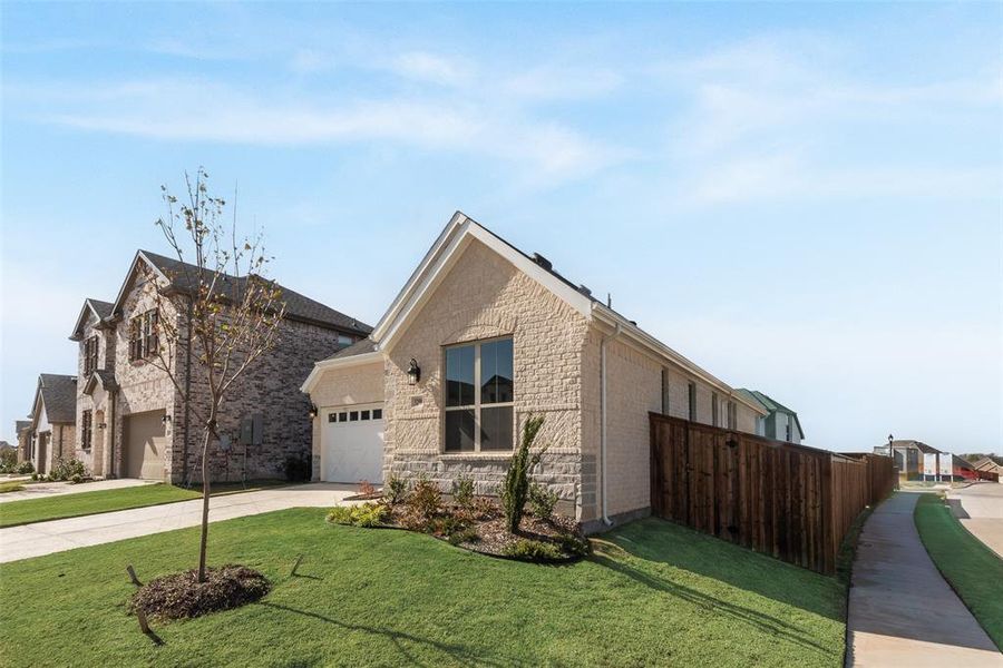 Front exterior of a new home in Villages of Hurricane Creek, Anna, TX, highlighting curb appeal (Image 1). Front exterior of a new home in Villages of Hurricane Creek, Anna, TX, highlighting curb appeal (Image 1).