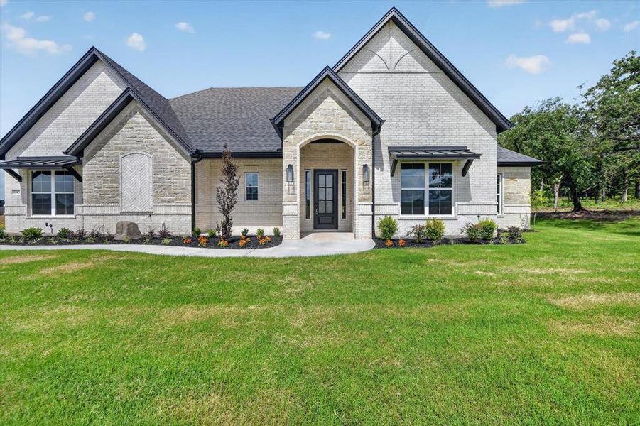 Front exterior of a new home in , Azle, TX, highlighting curb appeal (Image 1). Front exterior of a new home in , Azle, TX, highlighting curb appeal (Image 1).