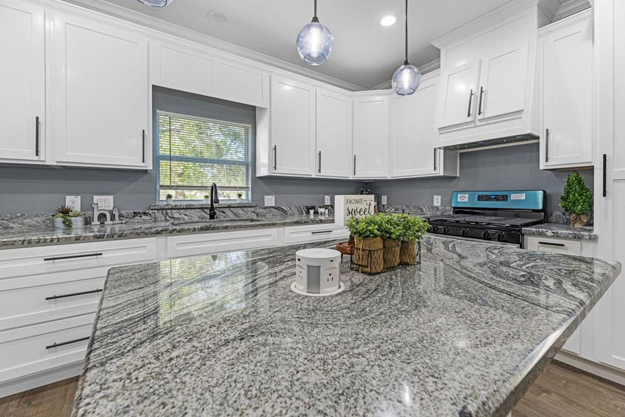 Check this out! There is a pop-up port charger. It even charges your new phone! just place it on top and watch it charge! So neat! Right on your kitchen island.