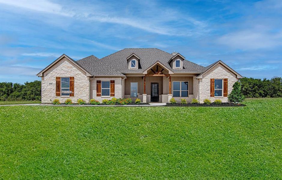 Craftsman-style house with a front yard