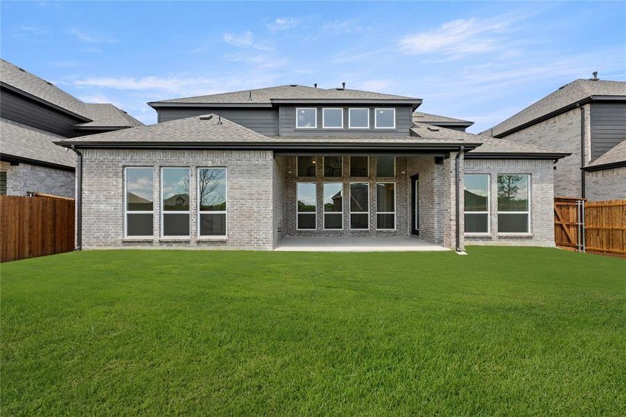 Front exterior of a new home in Valencia on The Lake, Little Elm, TX, highlighting curb appeal (Image 16).