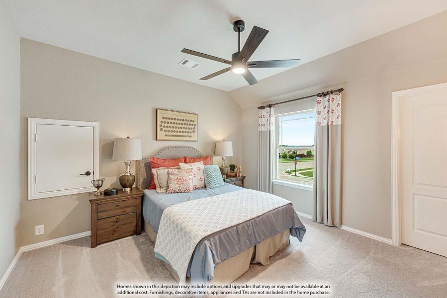 Bedroom with vaulted ceiling, ceiling fan, carpet flooring, and large window with outdoor view