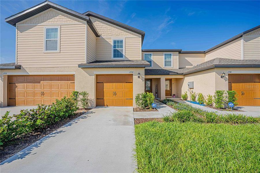 Front exterior of a new home in Hamlets of Tavares, Tavares, FL, highlighting curb appeal (Image 23). Front exterior of a new home in Hamlets of Tavares, Tavares, FL, highlighting curb appeal (Image 23).