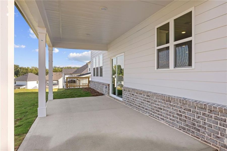 Exterior details and patio area of a home in The Estates at Gainesville Township, Gainesville (Image 3).