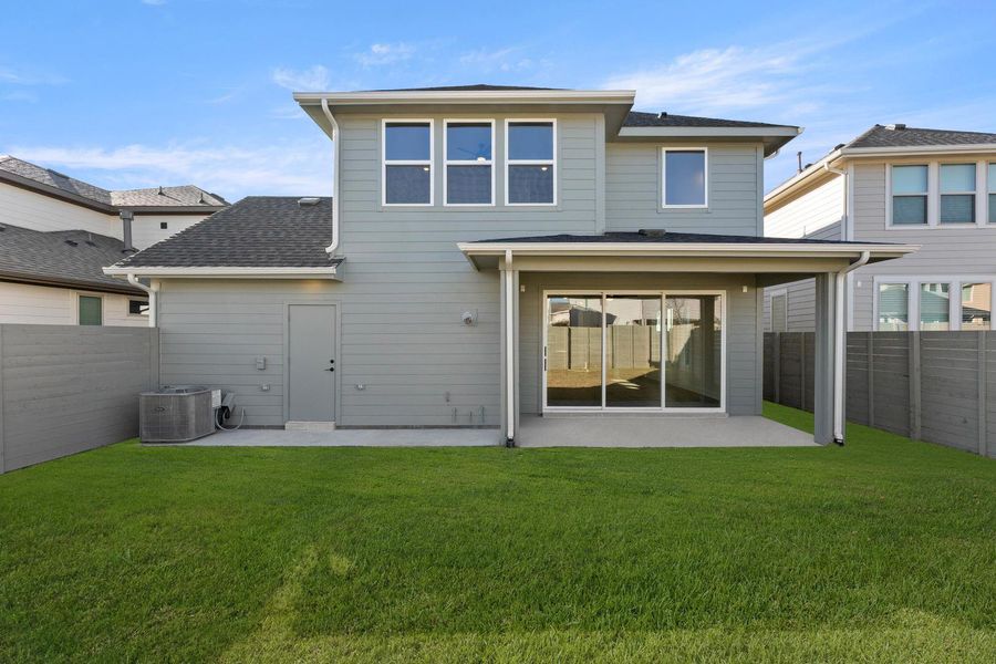 Exterior details and patio area of a home in Garden Collection at Harvest, Argyle (Image 4).