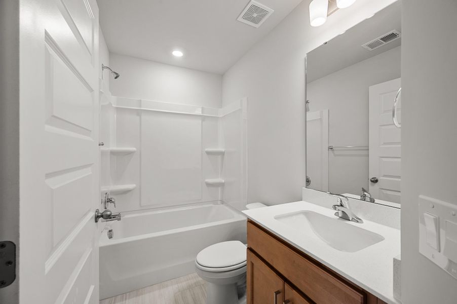 Photo is of a similar home