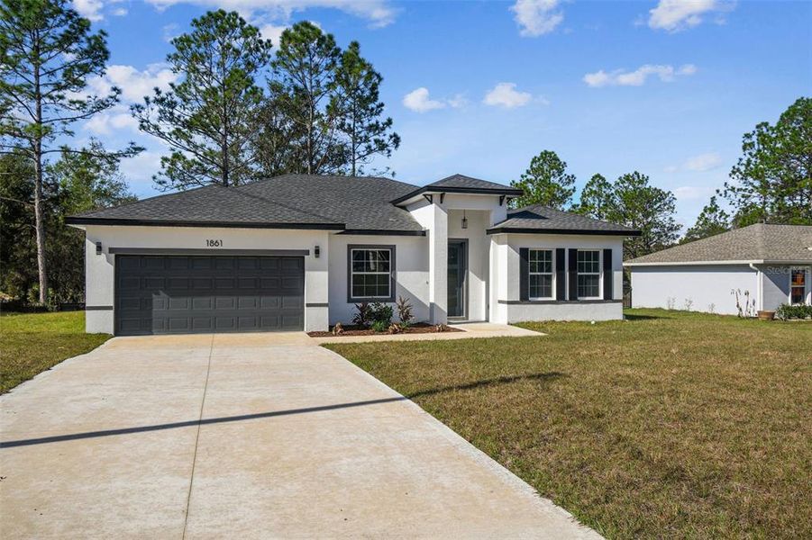 Front exterior of a new home in , Citrus Springs, FL, highlighting curb appeal (Image 21). Front exterior of a new home in , Citrus Springs, FL, highlighting curb appeal (Image 21).