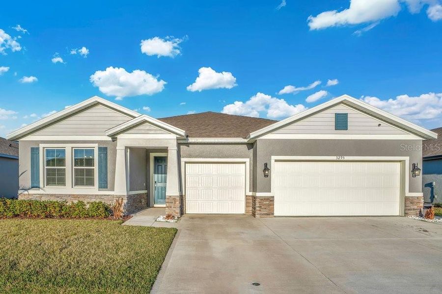 Front exterior of a new home in Archers Mill, Ormond Beach, FL, highlighting curb appeal (Image 27). Front exterior of a new home in Archers Mill, Ormond Beach, FL, highlighting curb appeal (Image 27).
