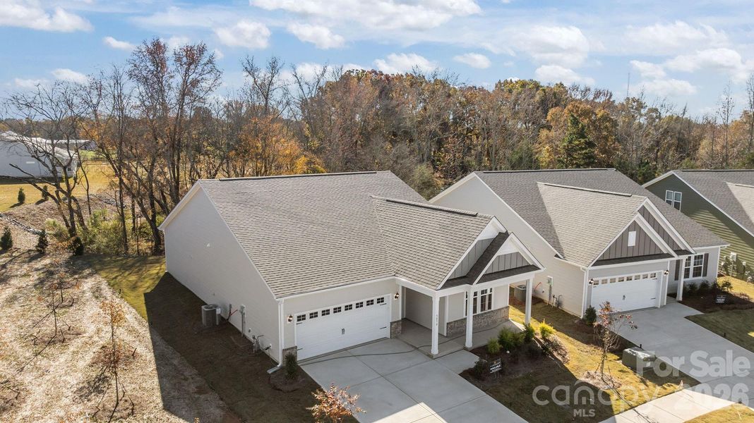 Front exterior of a new home in Cottages at Wingate, Wingate, NC, highlighting curb appeal (Image 2). Front exterior of a new home in Cottages at Wingate, Wingate, NC, highlighting curb appeal (Image 2).