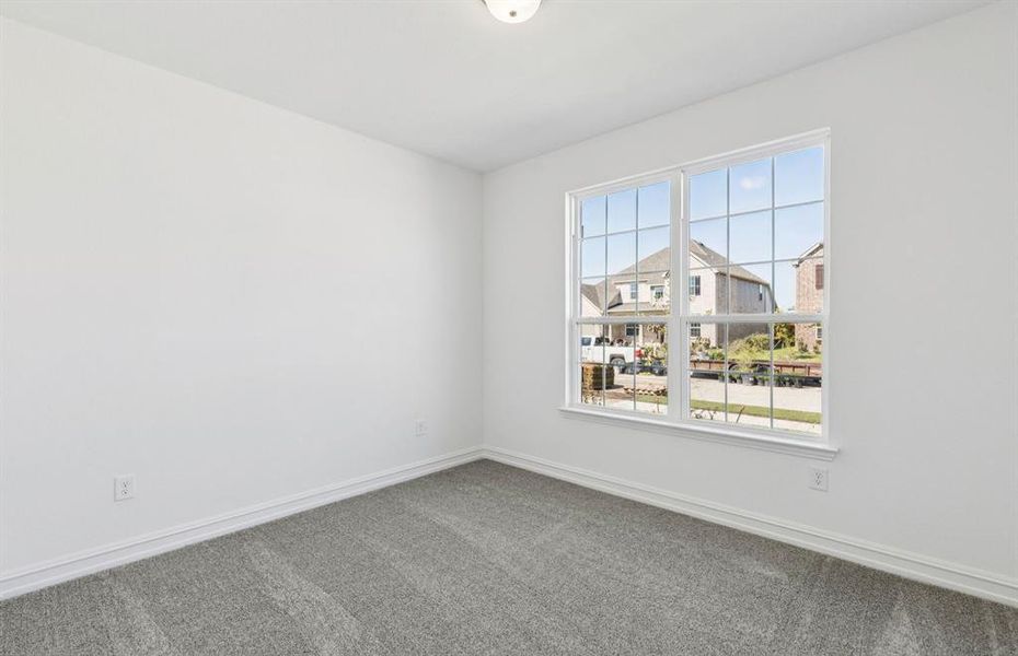 Spacious secondary bedroom with large windows