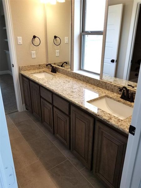 Jack & Jill bathroom with  granite dual vanity