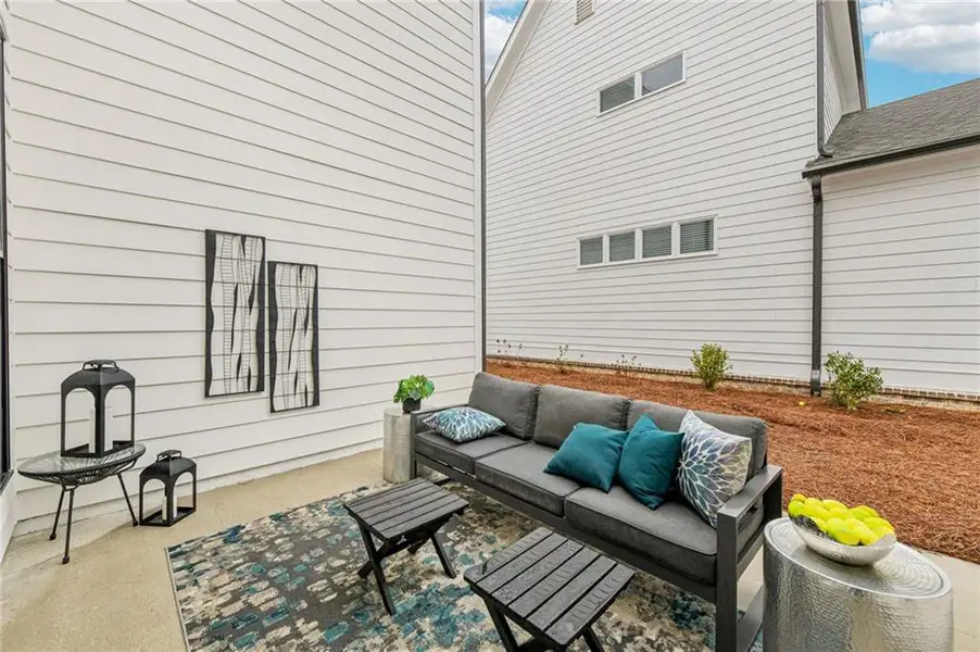 Exterior details and patio area of a home in Promenade at Sawnee Village, Cumming (Image 3).