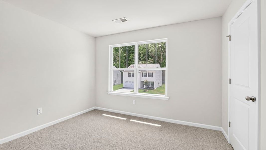 Spacious, unfurnished interior of a new home in Bentley Park, Greenwood (Image 28).