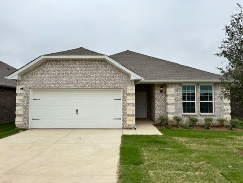 Ranch-style home featuring driveway, an attached garage, brick siding, a front lawn, and roof with shingles Ranch-style home featuring driveway, an attached garage, brick siding, a front lawn, and roof with shingles