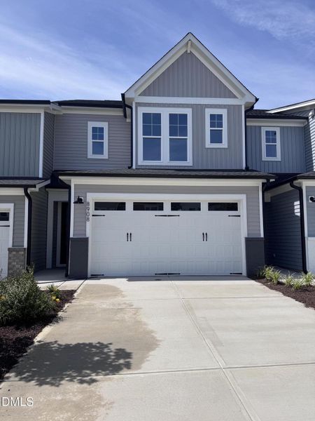 Front exterior of a new home in Kennebec Crossing, Angier, NC, highlighting curb appeal (Image 1). Front exterior of a new home in Kennebec Crossing, Angier, NC, highlighting curb appeal (Image 1).