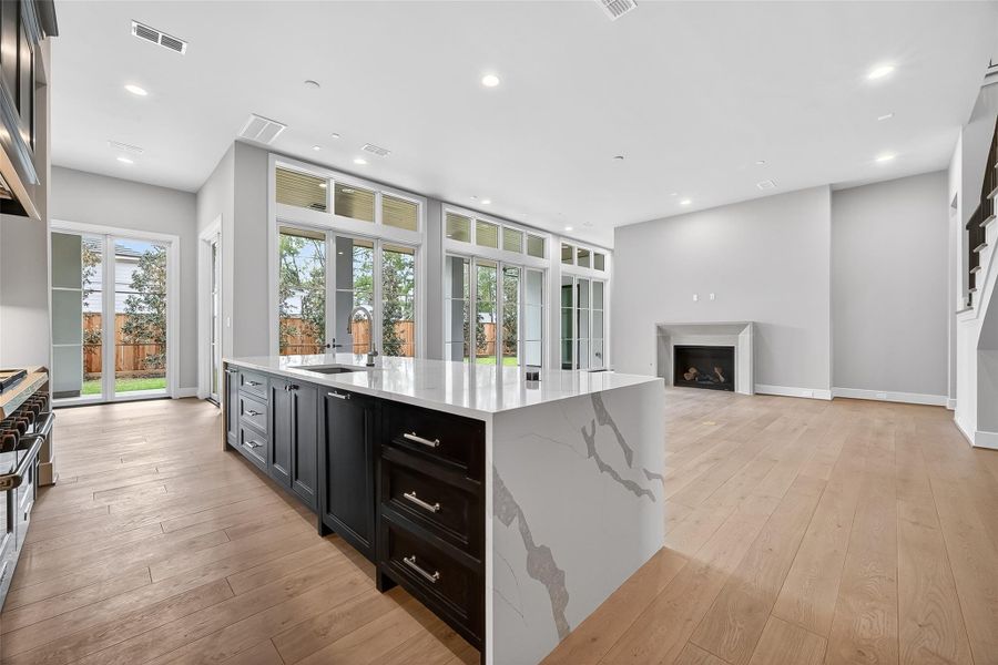 Undoubtedly, the gourmet kitchen is distinguished by its expansive island. Undoubtedly, the gourmet kitchen is distinguished by its expansive island.