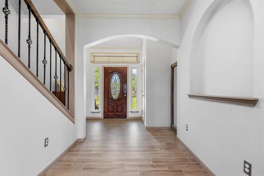 The wide entryway leads you to the open concept living area