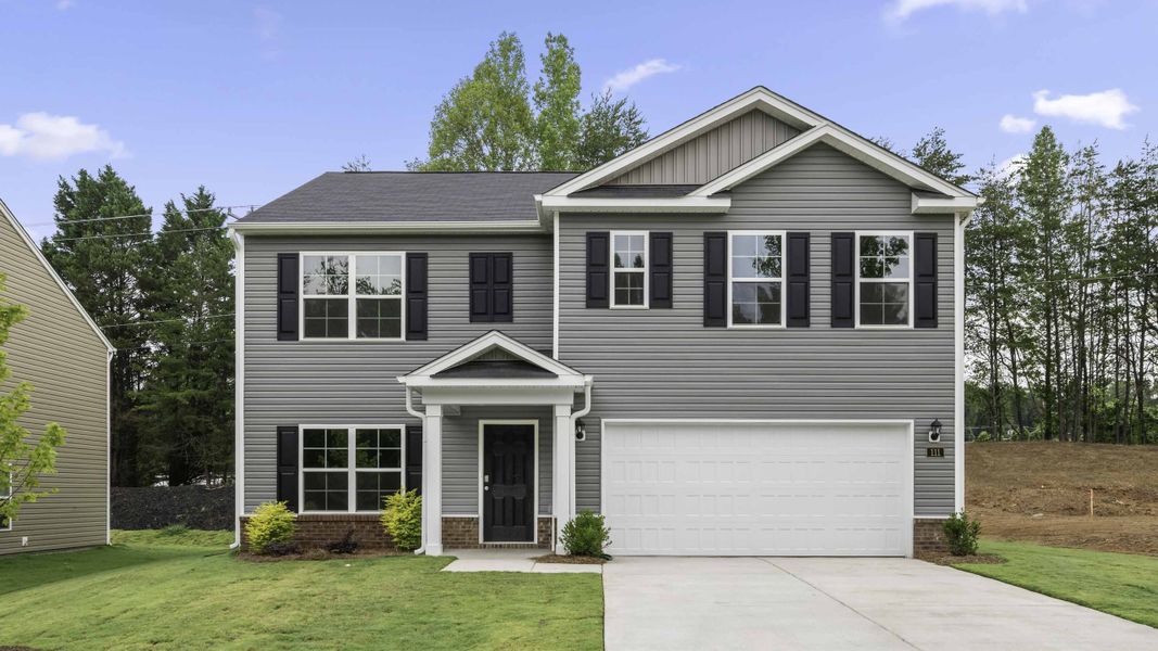 Front exterior of a new home in Foxtail, Yadkinville, NC, highlighting curb appeal (Image 1). Front exterior of a new home in Foxtail, Yadkinville, NC, highlighting curb appeal (Image 1).