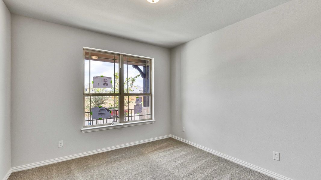 Furnished interior view inside a new home in Oaks at San Gabriel, Georgetown (Image 27).
