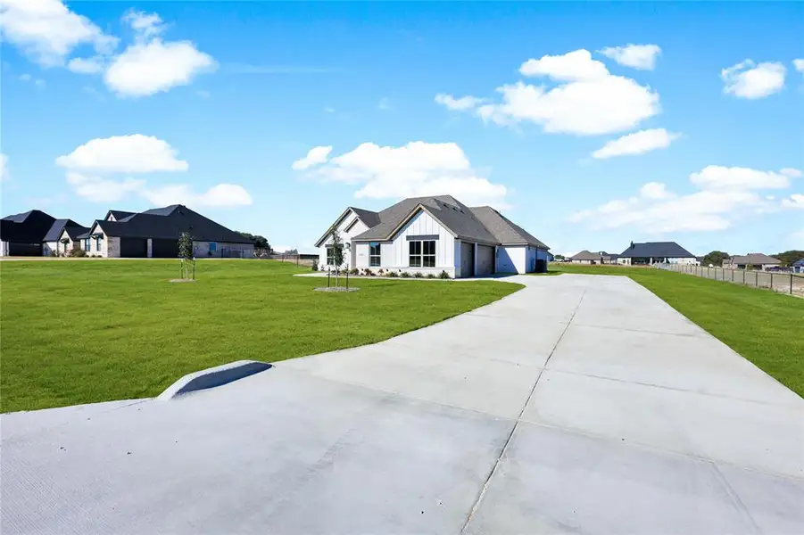 Front exterior of a new home in , Weatherford, TX, highlighting curb appeal (Image 25). Front exterior of a new home in , Weatherford, TX, highlighting curb appeal (Image 25).