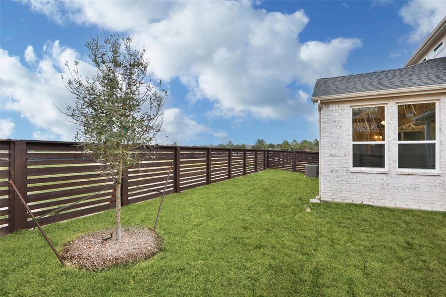 Exterior details and patio area of a home in Bridgeland Central, Cypress (Image 24).