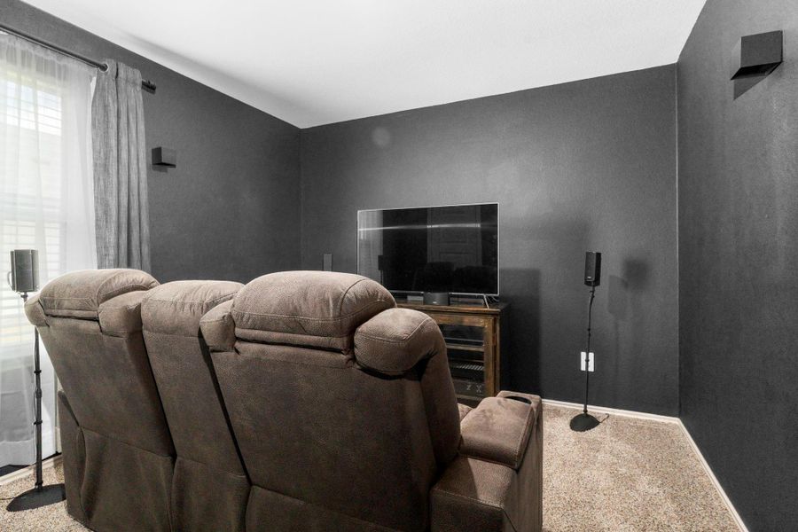 Cozy media or guest bedroom/bonus room with plush carpet, dark accent wall, and space to create the perfect home theater, game lounge, or private retreat. All bedrooms have wonderful walk-in closets. If you do not like this color we will be glad to paint this bedroom. Cozy media or guest bedroom/bonus room with plush carpet, dark accent wall, and space to create the perfect home theater, game lounge, or private retreat. All bedrooms have wonderful walk-in closets. If you do not like this color we will be glad to paint this bedroom.