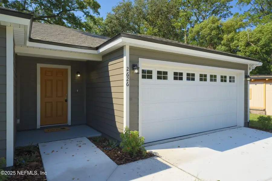 Front exterior of a new home in , Jacksonville, FL, highlighting curb appeal (Image 1).