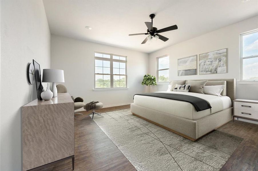 Bedroom featuring multiple windows, hardwood / wood-style flooring, and ceiling fan