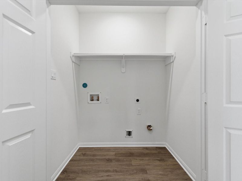 The dedicated utility room adds everyday ease with a well-designed space for laundry, storage, and household essentials.