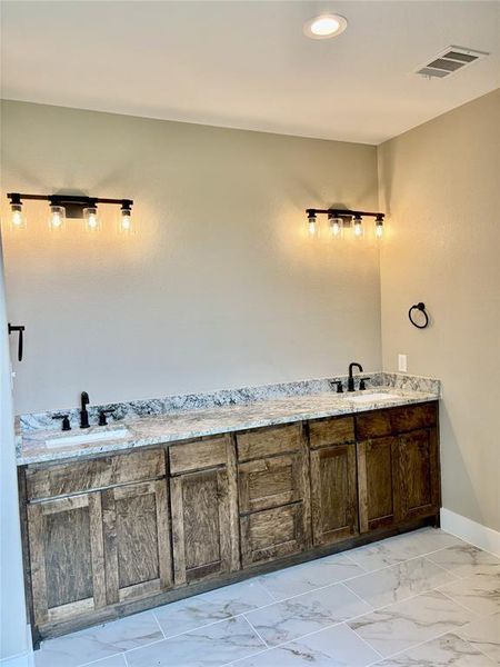 Bathroom with a shower stall Bathroom with a shower stall