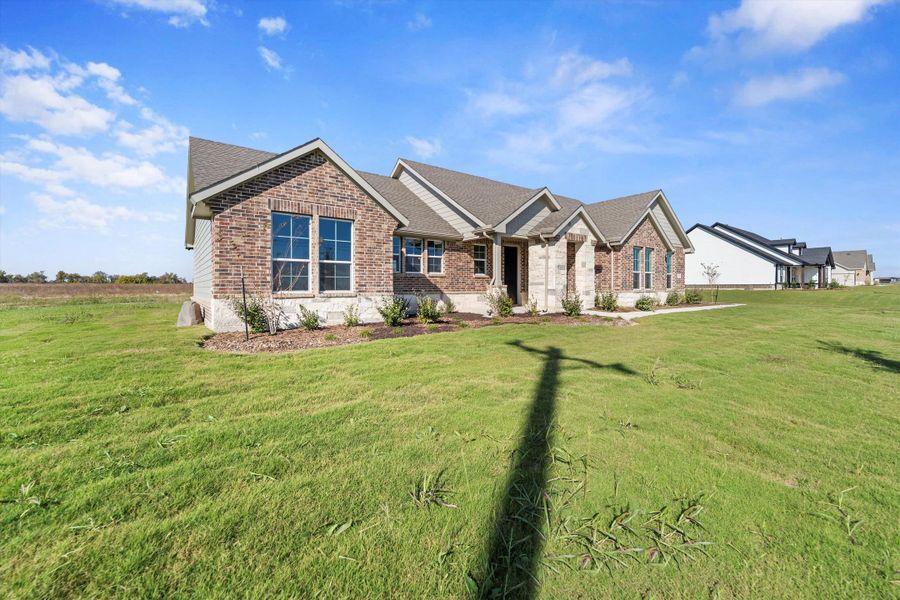 Front exterior of a new home in Clear Sky Addition, Valley View, TX, highlighting curb appeal (Image 23).