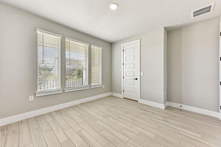 Unfurnished room featuring light wood finished floors and recessed lighting