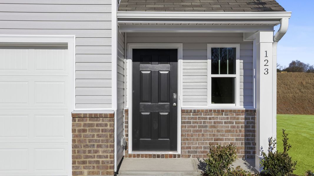 Exterior details and patio area of a home in Village Grove, Greenville (Image 3).