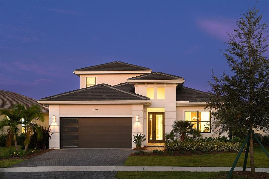 Front exterior of a new home in Cresswind Lakewood Ranch, Lakewood Ranch, FL, highlighting curb appeal (Image 2). Front exterior of a new home in Cresswind Lakewood Ranch, Lakewood Ranch, FL, highlighting curb appeal (Image 2).