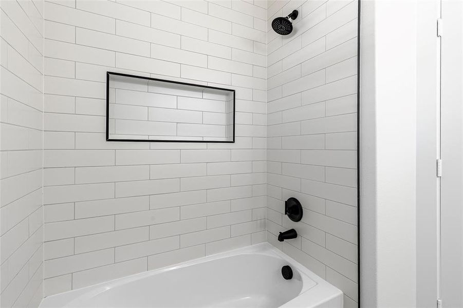 Bathroom featuring bathing tub / shower combination